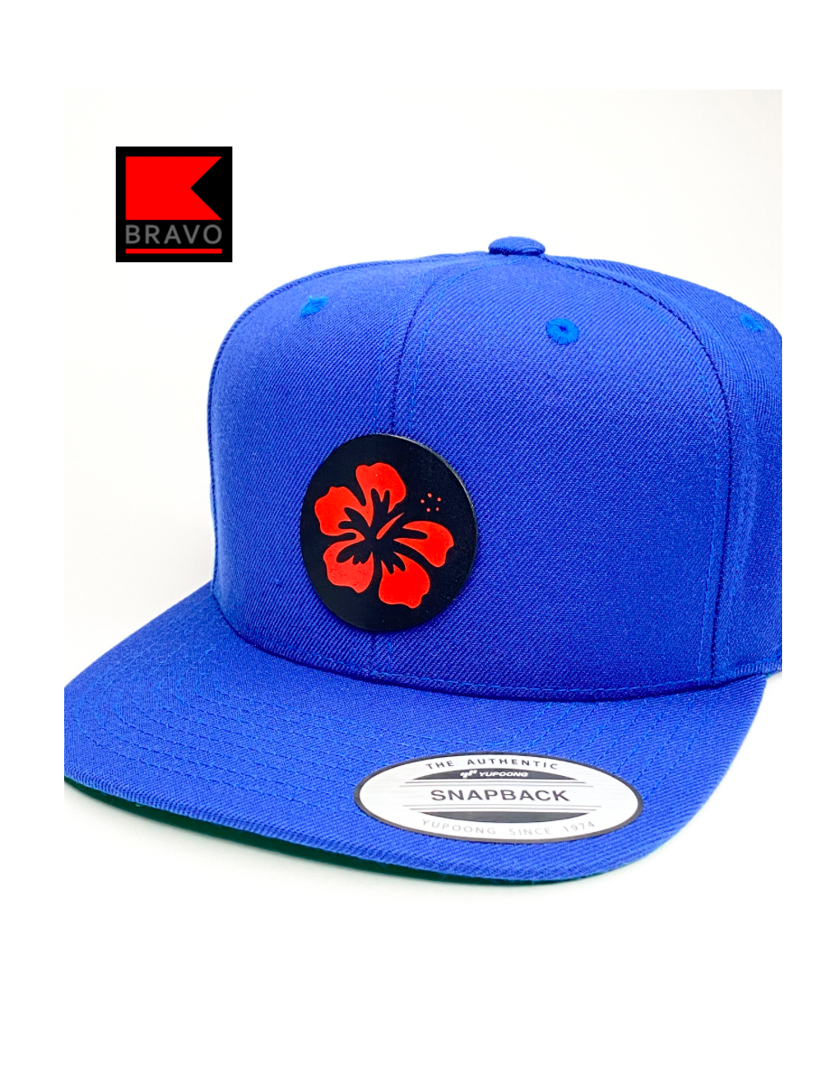 Bravo Cay hat in royal blue with flower design leather patch