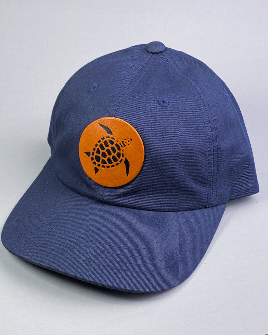 Bravo Premium hat in navy blue with sea turtle design leather patch