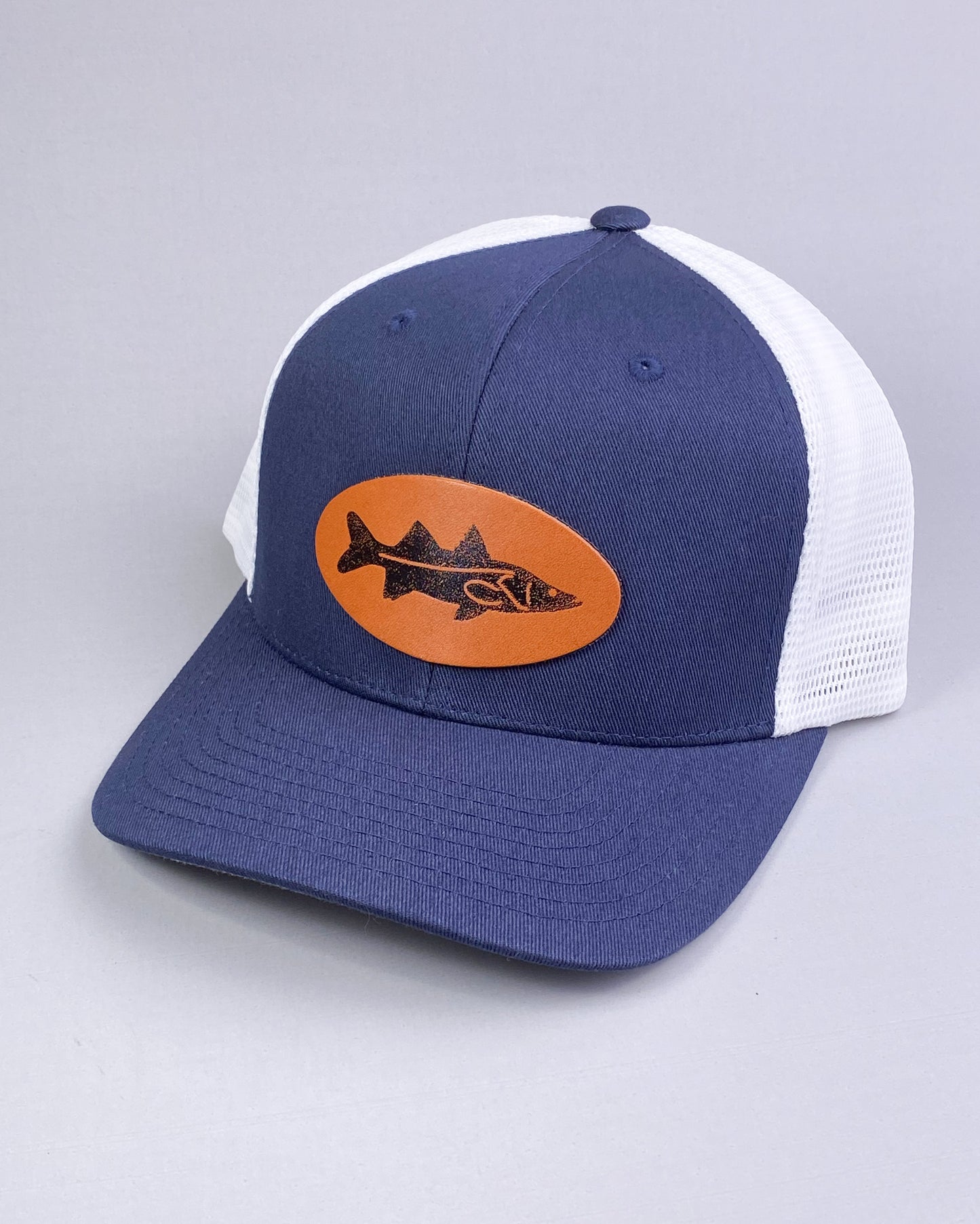 Bravo Cay hat in navy blue/white with snook design leather patch