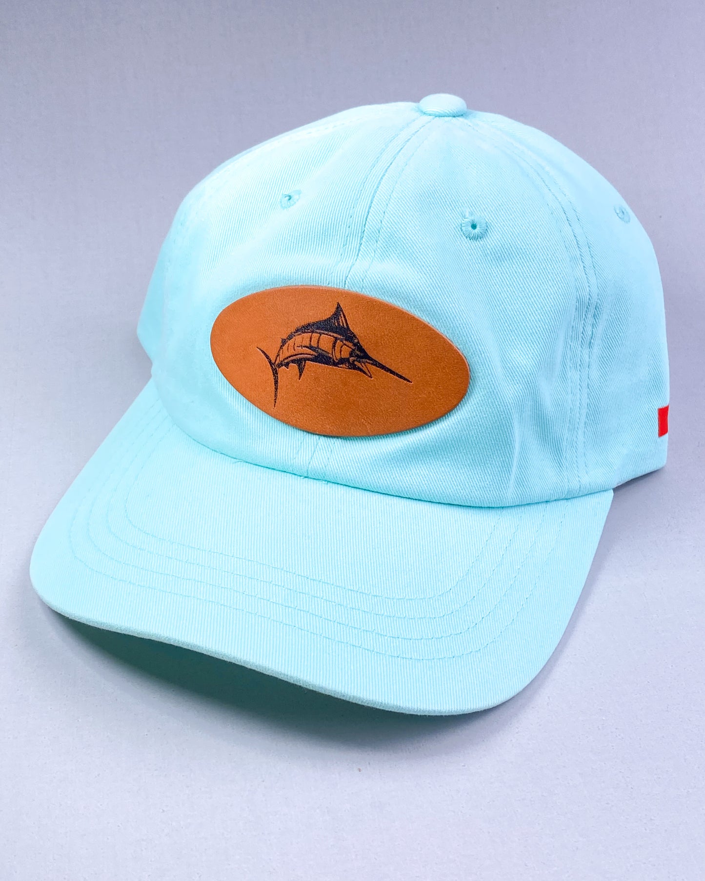 Bravo Cay hat in teal with marlin design leather patch