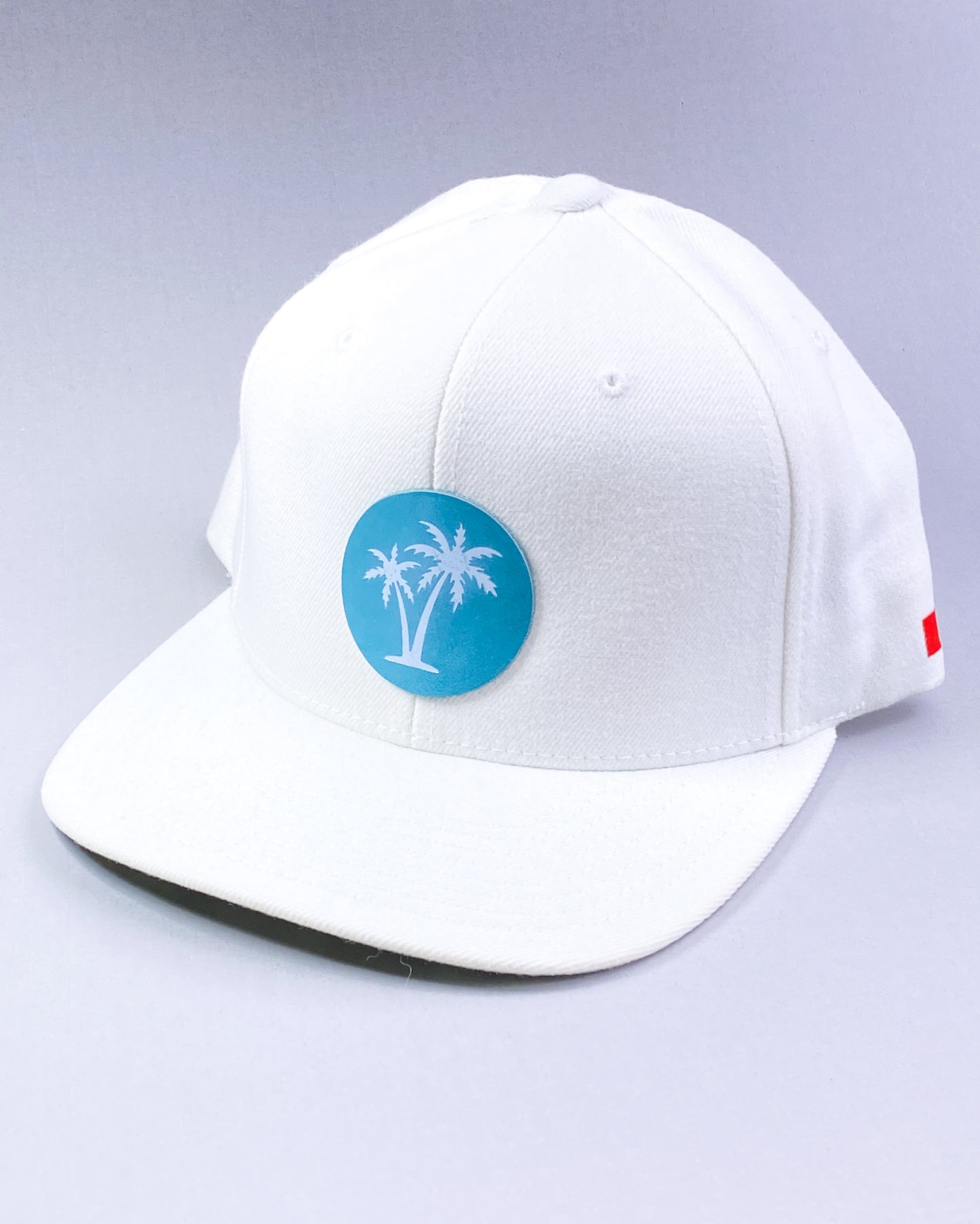 Bravo Cay hat in white with two palm design leather patch