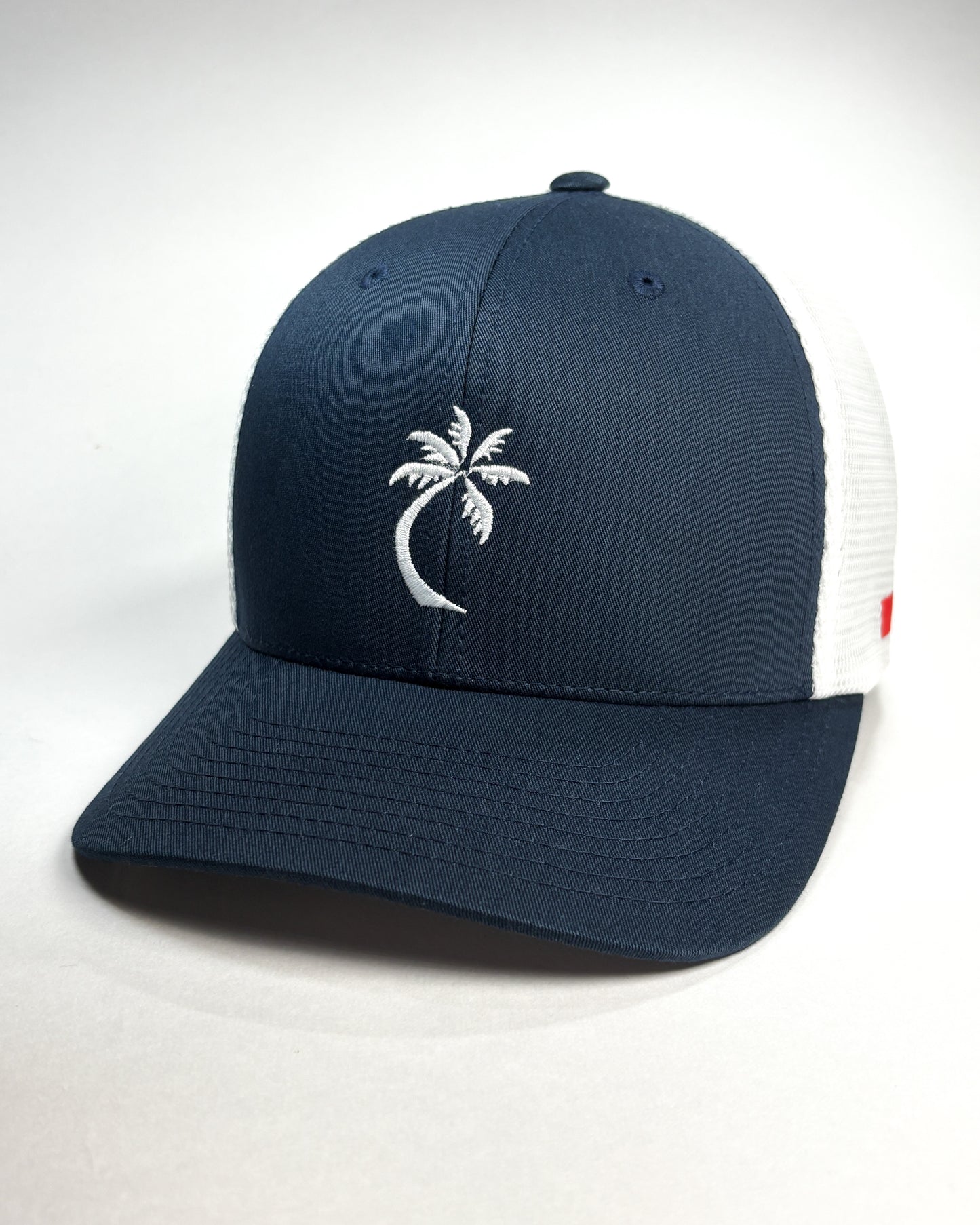 Bravo Cay hat in navy/white with embroidered single palm design
