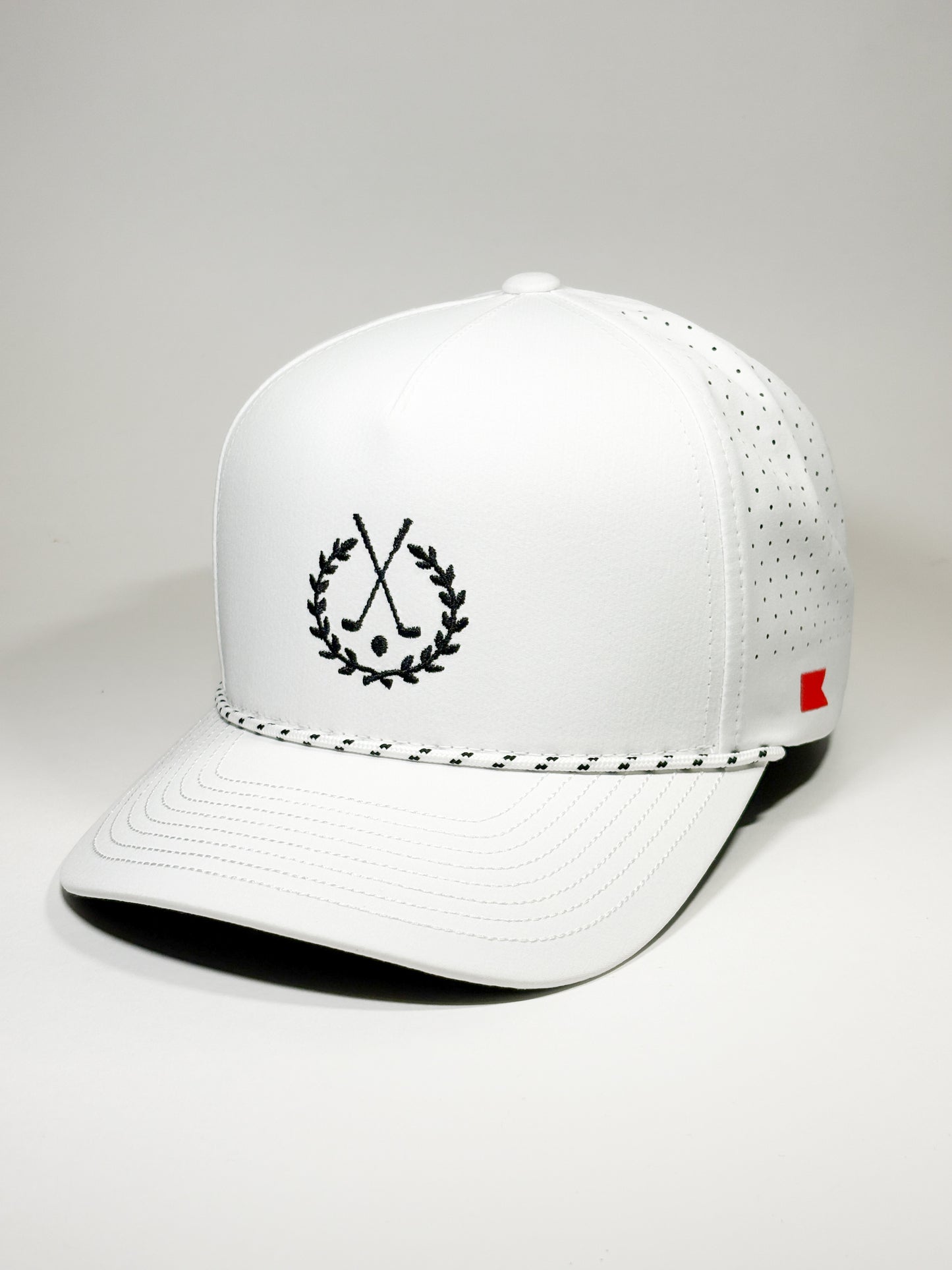 Bravo Cay rope trim hat in white with golf themed design embroidered in black