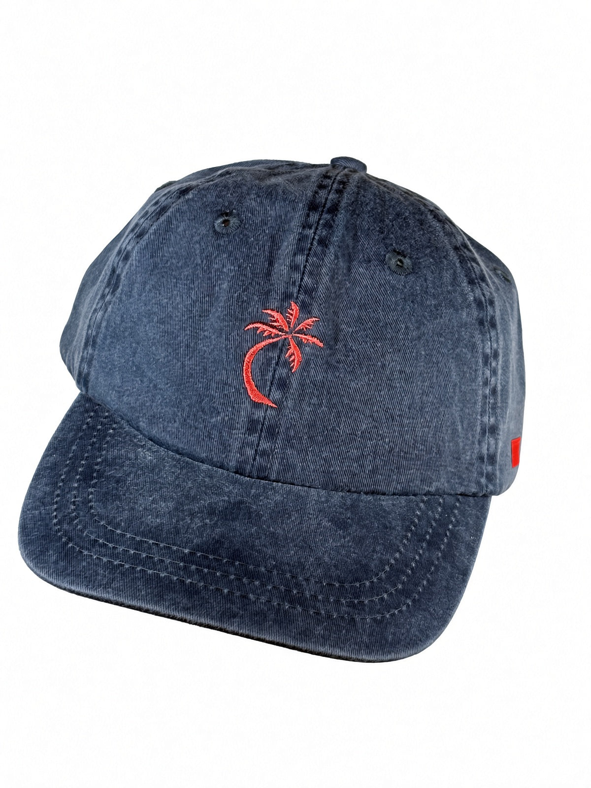 Bravo Cay Kids Collection youth hat in navy blue with embroidered 1 palm design in coral