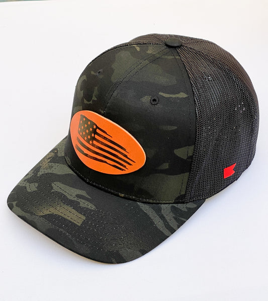 Bravo Cay hat in dark camo with distressed flag design leather patch