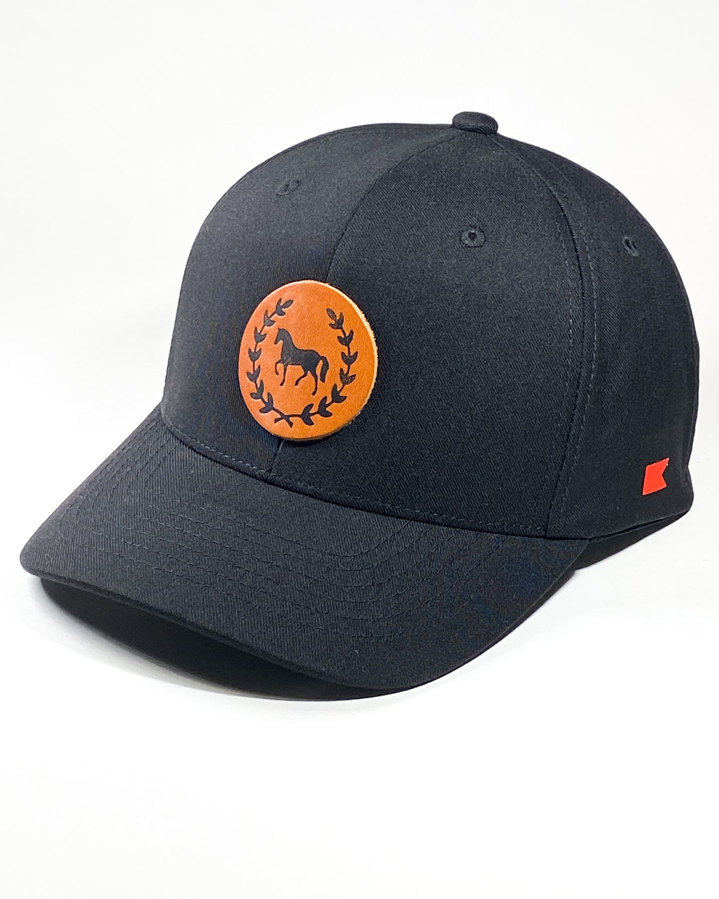 Bravo Cay hat in black with equestrian themed design leather patch