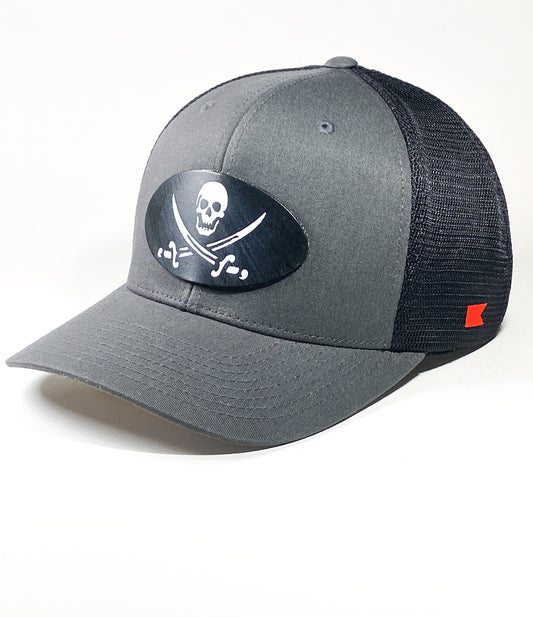 Bravo Cay hat in charcoal/black mesh with pirate themed design leather patch