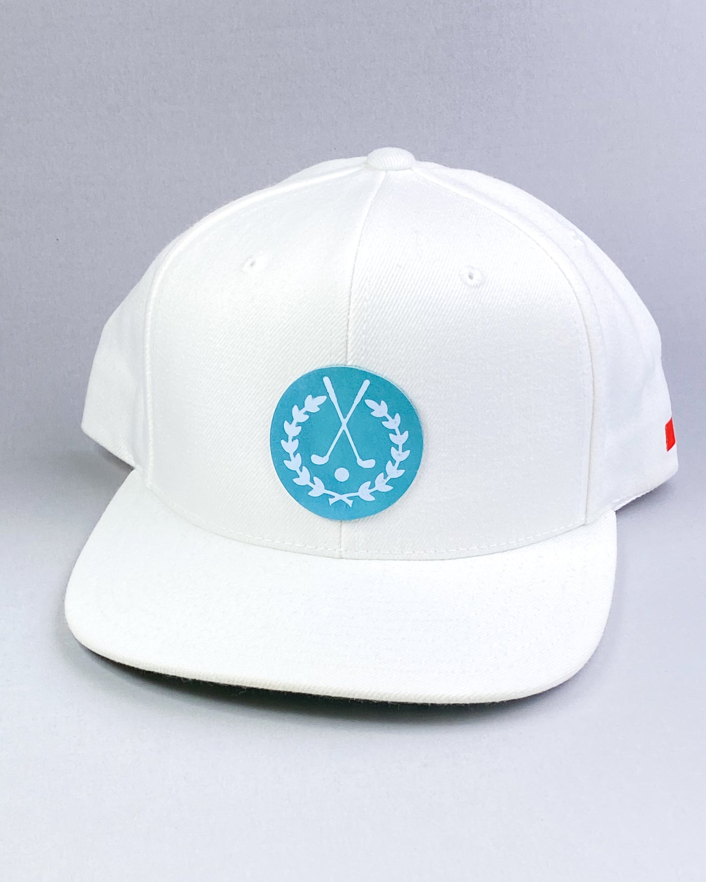 Bravo Cay hat in white with golf themed design leather patch