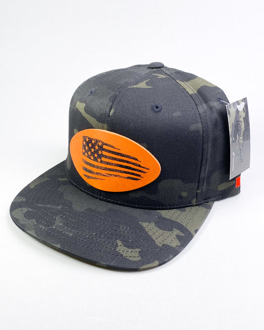 Bravo Cay hat in dark camo with distressed flag design leather patch
